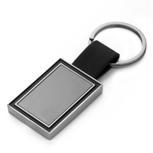 Chaveiro com Chapinha Central ZB 15000 | metal em níquel brilhante com alça em PU.